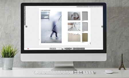 Desktop-Computer mit Bild des interaktiven Katalogs.
