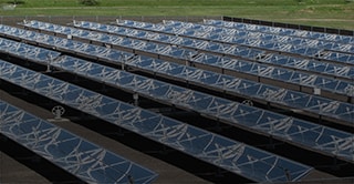 Several rows of solar panels made with 3M mirror film.