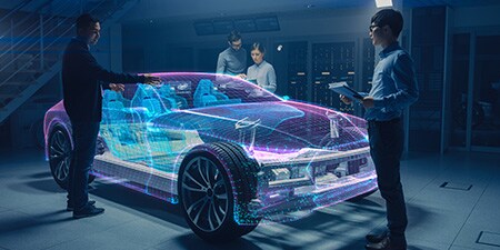 Automobildesigner um eine holografische Ansicht eines Fahrzeugs
