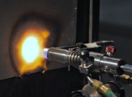 flame torch on flame barrier material