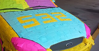 Police detective Stuart Littlefield’s car covered in colorful Post-it Notes, a clever prank done by co-workers.