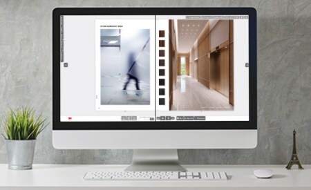 Computermonitor mit interaktivem Katalog, der Glas- und Oberflächenveredelungen zeigt.
