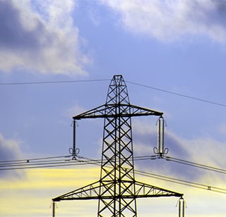 Electrical tower in a blue sky.